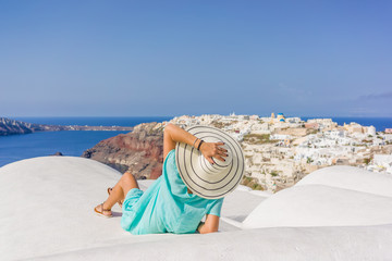 Fototapeta na wymiar Young woman on holidays, Santorini Oia town