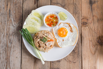 Pork fried rice and fried egg with vegetable. Top view.