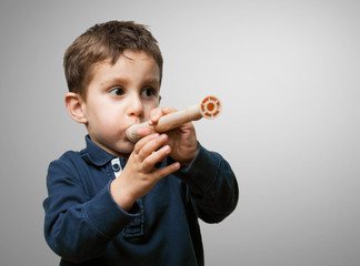 little kid playing flute © asierromero