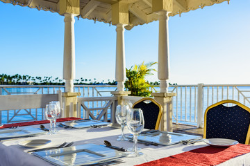 festive table in the gazebo at sunset