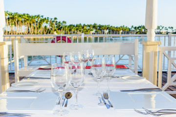 festive table in the gazebo at sunset