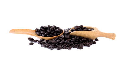 Fresh coffee beans in  wooden scoop and wooden spoon  isolated o
