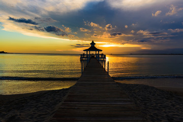 gazebo bridge sea at sunset