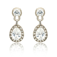 Pair of silver diamond earrings isolated on white