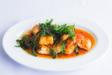 Close up deep fried grouper fish spicy sweet and sour sauce