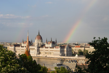 Rainbow over Parlament in Budapest with riverside in Hungary © photo_superteam