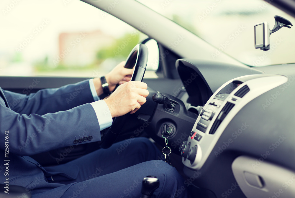 Poster close up of young man in suit driving car