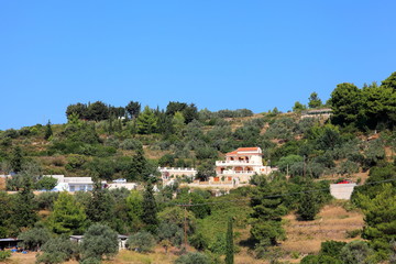 Fototapeta na wymiar Detached house near the road,Alonissos,Greece