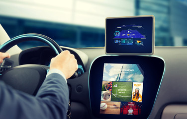 close up of man with gps on tablet pc driving car