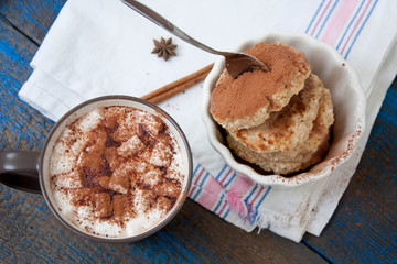 Russian cheese pancakes and cocoa with marshmallow on a wooden background. sweet delicious Russian food