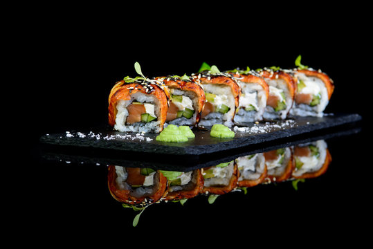 Canadian roll on a black background with reflection