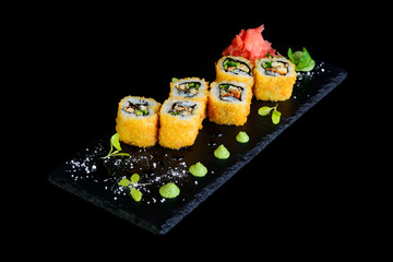 fried roll with eel on a black background