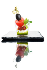 Canapes of cheese vegetables on white background