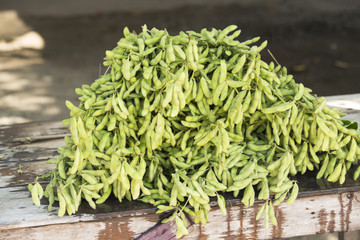 green soybeans on wooden table
