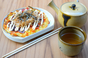 Japanese food okonomiyaki , Japanese pizza. Traditional food in Hiroshima, Japan
