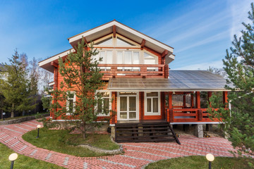 Wooden cottage of red painted logs