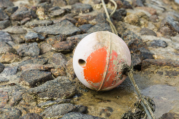 Old buoy on bubble in the coastal area