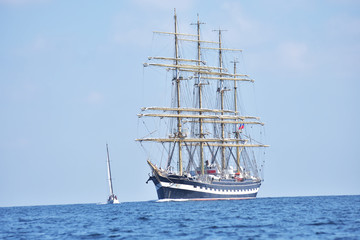 Fototapeta na wymiar Tall ship regatta in a open sea.