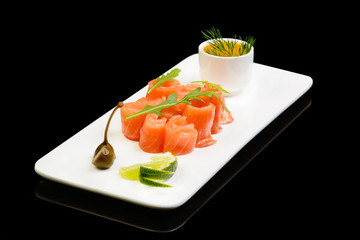 salted salmon roll on black background