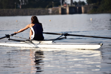 Scull rowing team training. Athletic water sport.