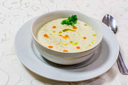 Vegetable cream soup in white bowl