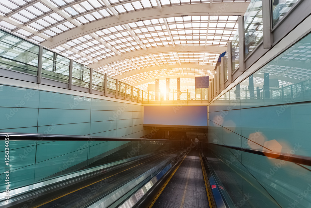 Wall mural escalator within the airport