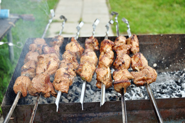 Meat is roasted on the grill