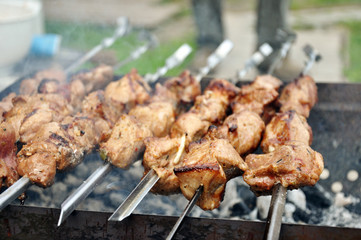 Meat is roasted on the grill