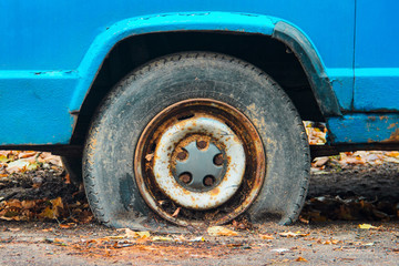 Close-up view flat rear tire on a car
