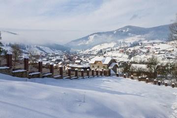 winter village landscape in Carpathian mountains