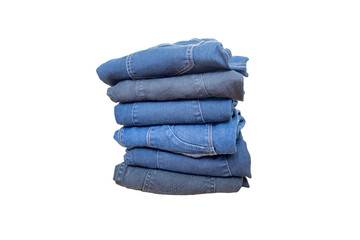 Blue jeans stacked isolated on white background.