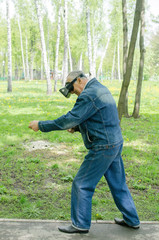 Aged man is using virtual glasses 