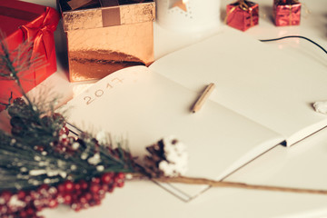 2017 written on notebook with new years decorations in retro style
