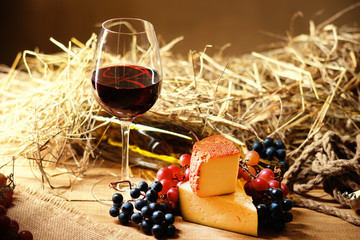 Glass of wine, grape and chesse 
