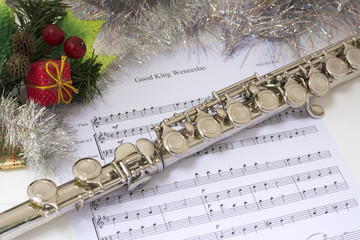 Christmas decoration with flute across a musical score © Daniel Ferryanto