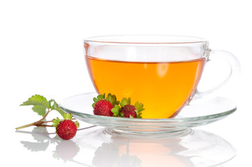 Glass cup of tea with strawberry isolated on white background