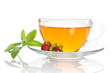 Glass cup of tea with strawberry and mint isolated on white back