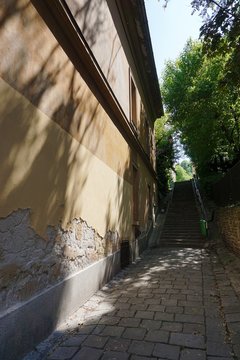 Old European narrow street with stairs
