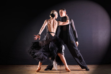 dancers in ballroom isolated on black background