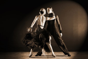 dancers in ballroom isolated on black background