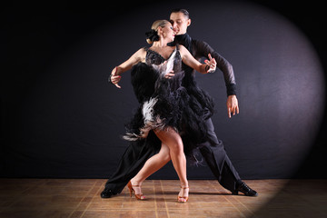 dancers in ballroom isolated on black background