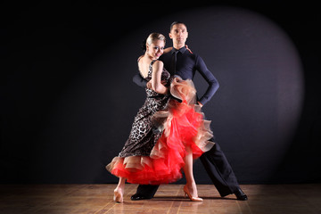 dancers in ballroom isolated on black background
