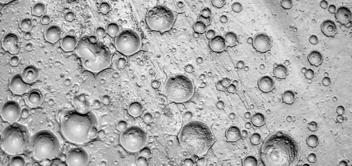 Small craters in mud volcanoes's clay river