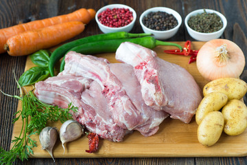 Raw Pork Loin Steaks on cutting board