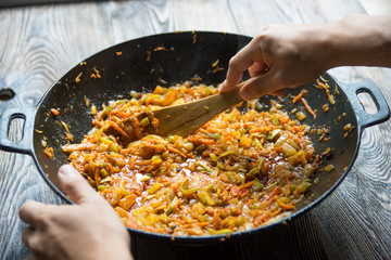 Cooking chongqing vegetables in wok at home