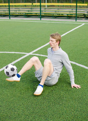 Young man making football freestyle