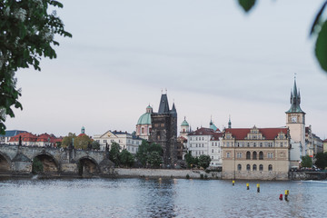 Fototapeta premium Prague cityscape in spring. View of old city center from the opposite bank of Vltava river after sunset
