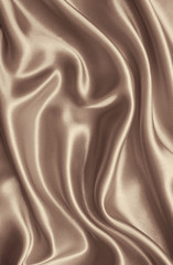 Smooth elegant golden silk or satin texture as background. In Se