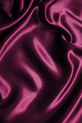 Smooth elegant pink silk or satin texture as background