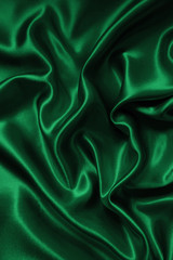 Smooth elegant green silk or satin texture as background